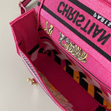 Handle and strap detail of signature statement women's handbag – women's statement bag