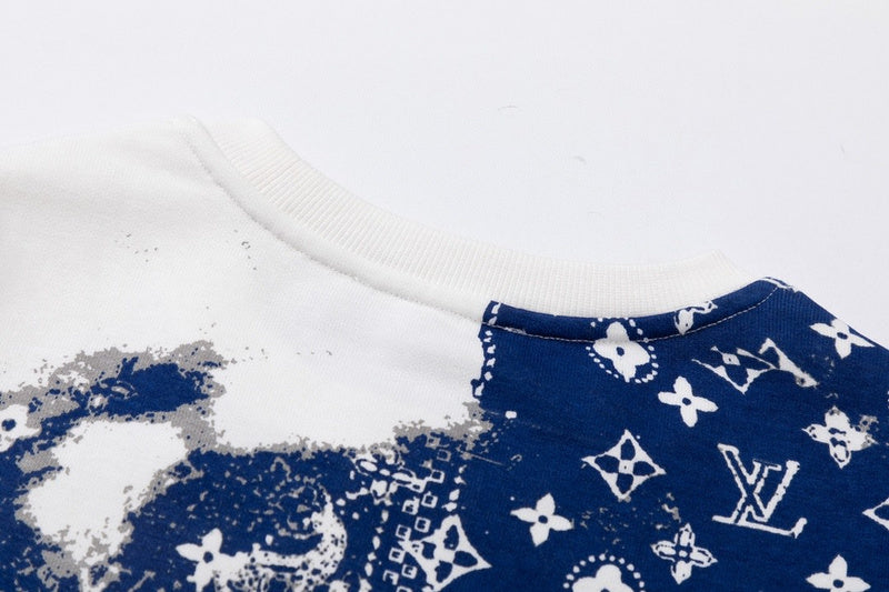Close-up detail shot of Louis Vuitton luxury clothing with signature branding