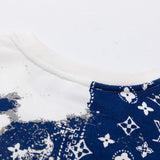 Close-up detail shot of Louis Vuitton luxury clothing with signature branding