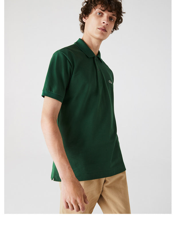 Side profile of Lacoste luxury clothing with monogram-inspired silhouette