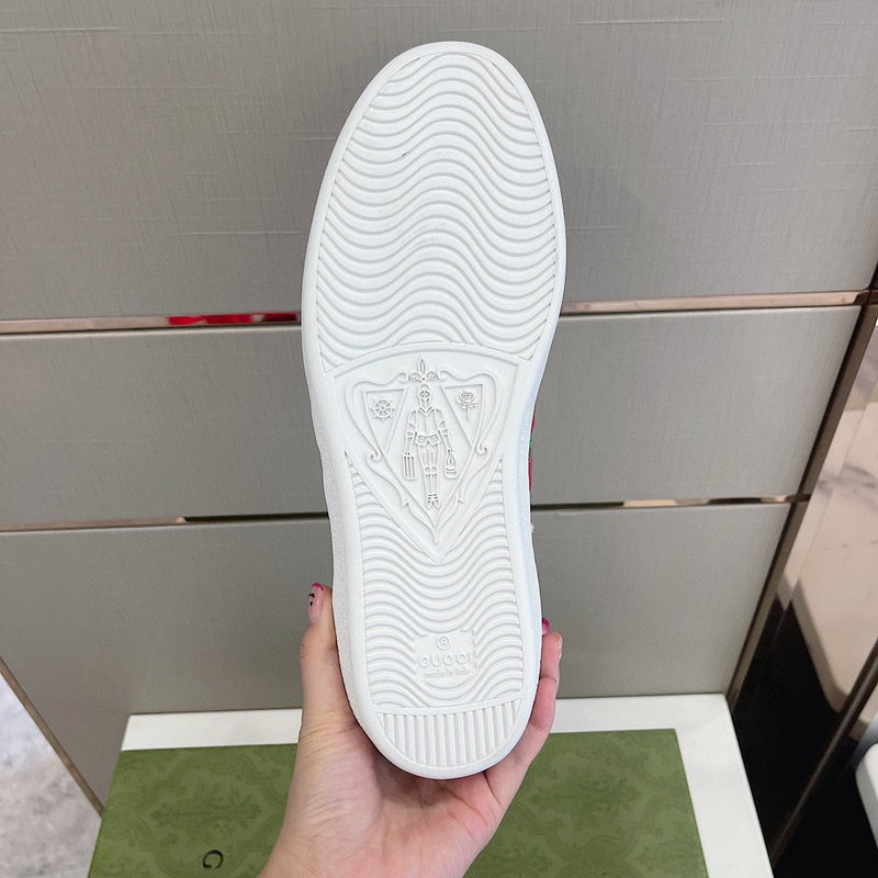 Side profile of Gucci fresh white-and-black sneakers streetwear statement look