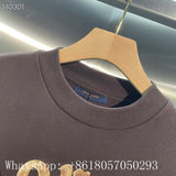 Flat lay presentation of Louis Vuitton luxury clothing with runway-inspired design