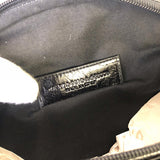 Side profile of polished premium women's handbag – women's luxury accessory