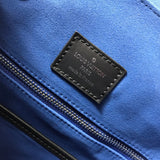 Side profile of structured chic women's handbag – women's luxury accessory