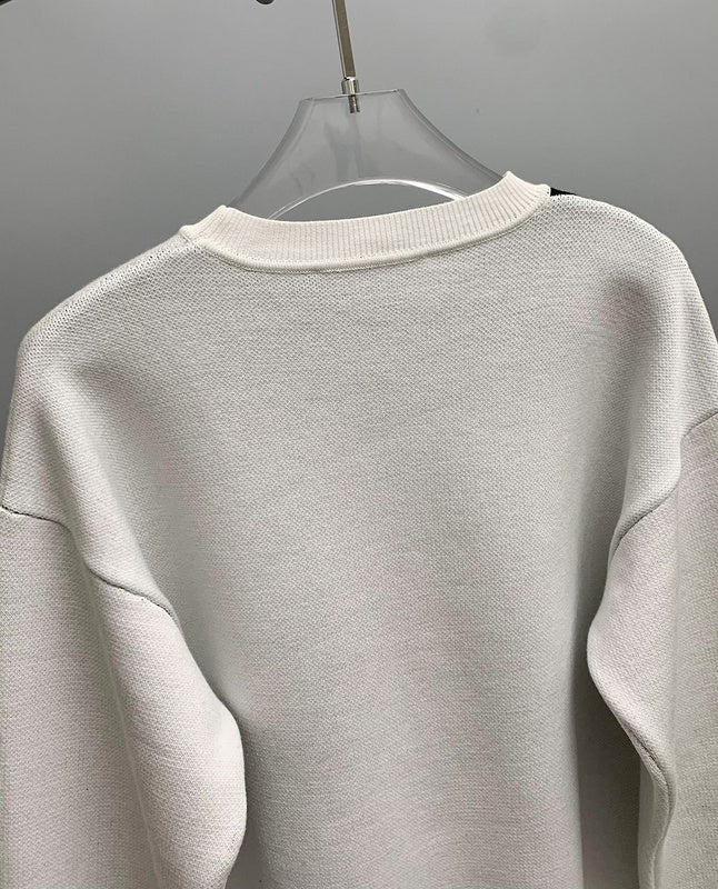Close-up detail shot of Louis Vuitton luxury clothing with logo-detail design