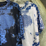 Flat lay presentation of Louis Vuitton cotton t-shirt with runway-inspired design