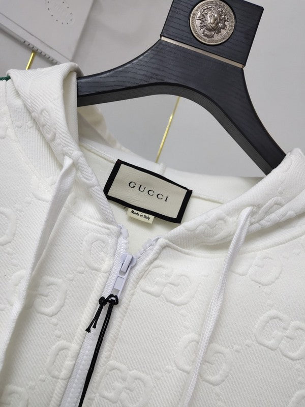 Side profile of Gucci luxury clothing with label-forward styling