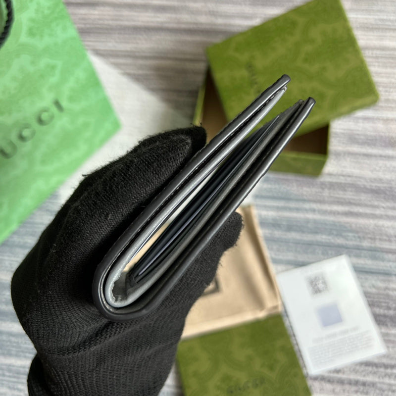 Handle and strap detail of polished signature women's handbag – women's luxury accessory