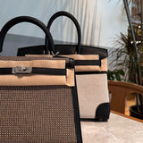 Side view of refined structured handbag