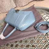 Styled lifestyle shot of polished classic women's handbag – women's luxury accessory