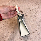 Side view of polished structured handbag
