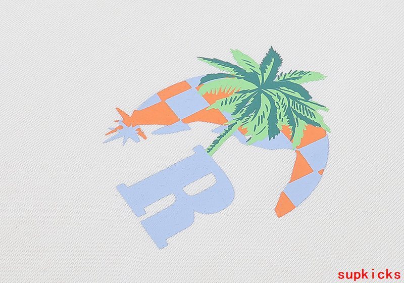 Close-up detail shot of Rhude luxury clothing with signature branding