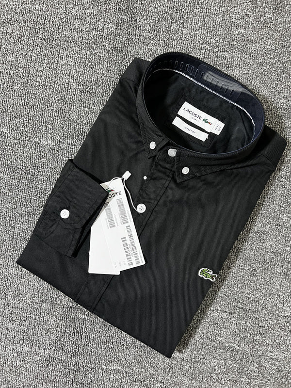 Flat lay presentation of Lacoste luxury clothing with logo-detail design