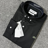 Flat lay presentation of Lacoste luxury clothing with logo-detail design
