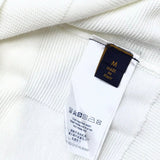 Side profile of Louis Vuitton luxury clothing with signature branding