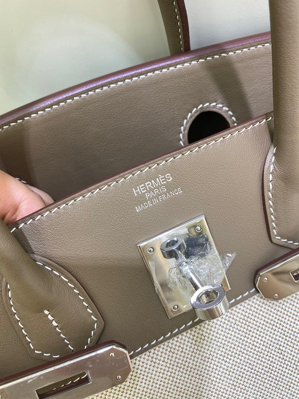 Side view of tailored structured handbag