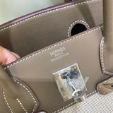 Side view of tailored structured handbag