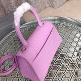 Handle and strap detail of statement modern women's handbag – women's luxury accessory