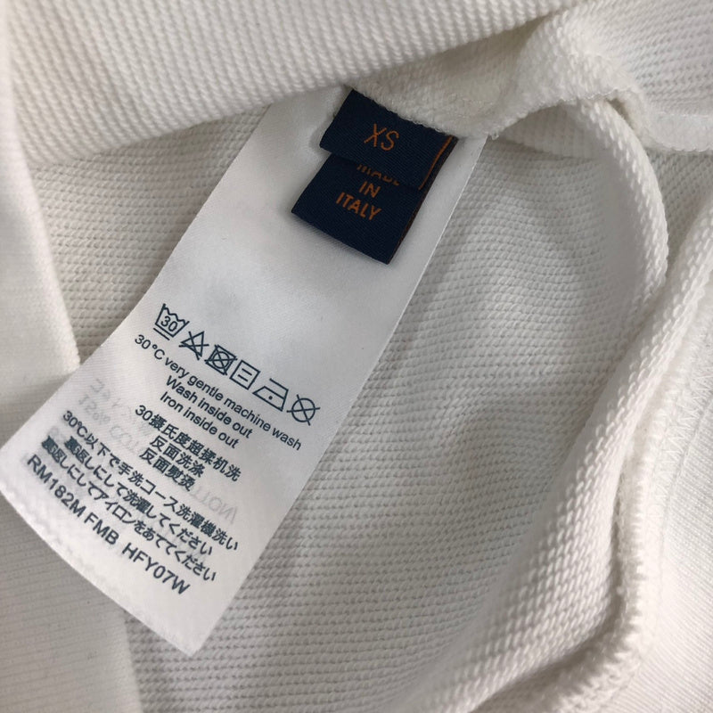 Side profile of Louis Vuitton luxury clothing with signature branding