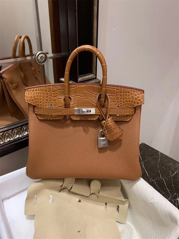  Sleek top-handle bag carried on shoulder 10