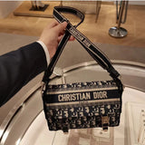 Back view of structured signature women's handbag – women's designer-style accessory