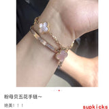Lifestyle view of Van Cleef & Arpels unisex jewelry piece