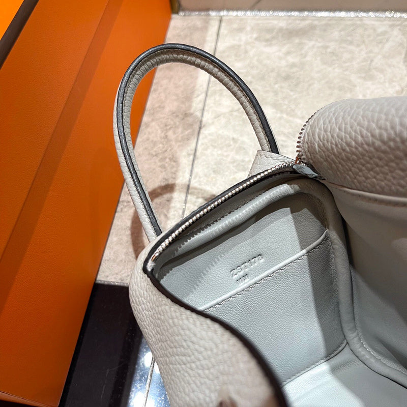 Side view of tailored structured handbag