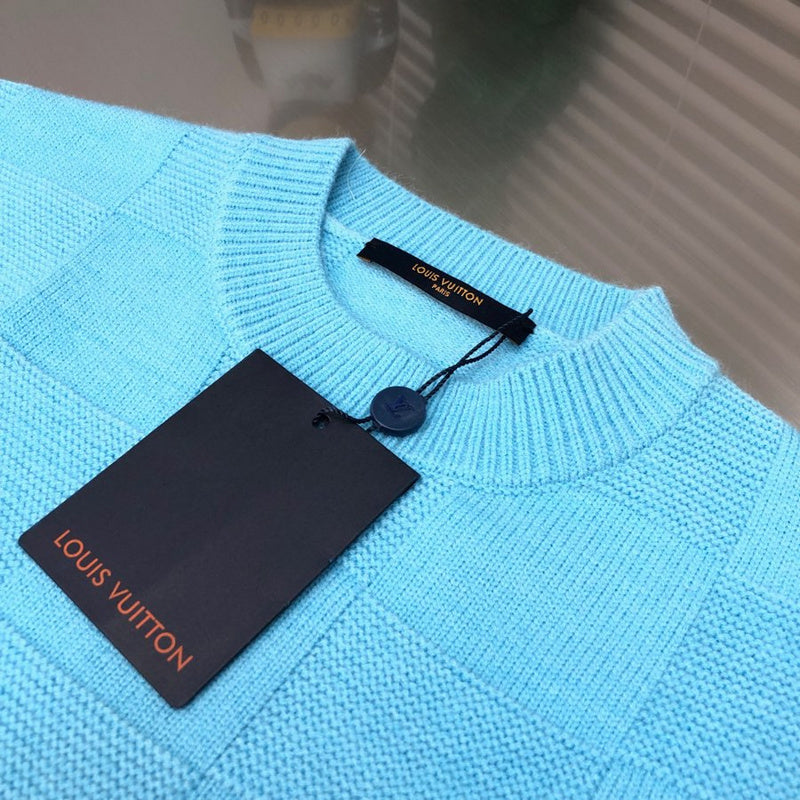 Close-up detail shot of Louis Vuitton luxury clothing with monogram-inspired silhouette