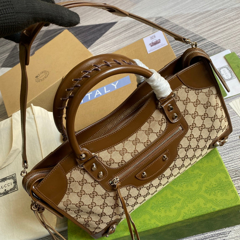 Handle and strap detail of polished refined women's handbag – women's luxury handbag