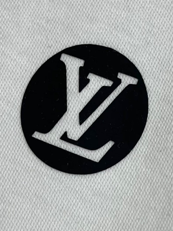 Flat lay presentation of Louis Vuitton luxury clothing with tailored silhouette