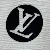 Flat lay presentation of Louis Vuitton luxury clothing with tailored silhouette