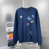 Back view of Louis Vuitton luxury clothing with label-forward styling