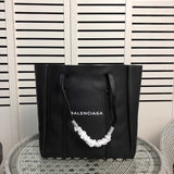 Front view of sleek premium women's handbag – women's premium purse