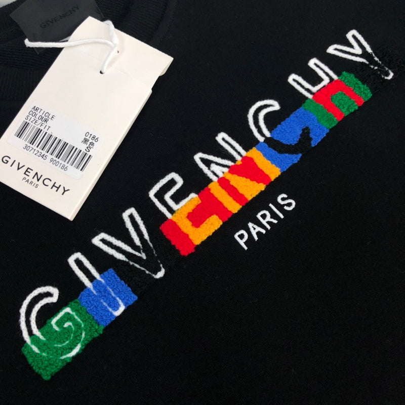 Flat lay presentation of Givenchy luxury clothing with contemporary cut
