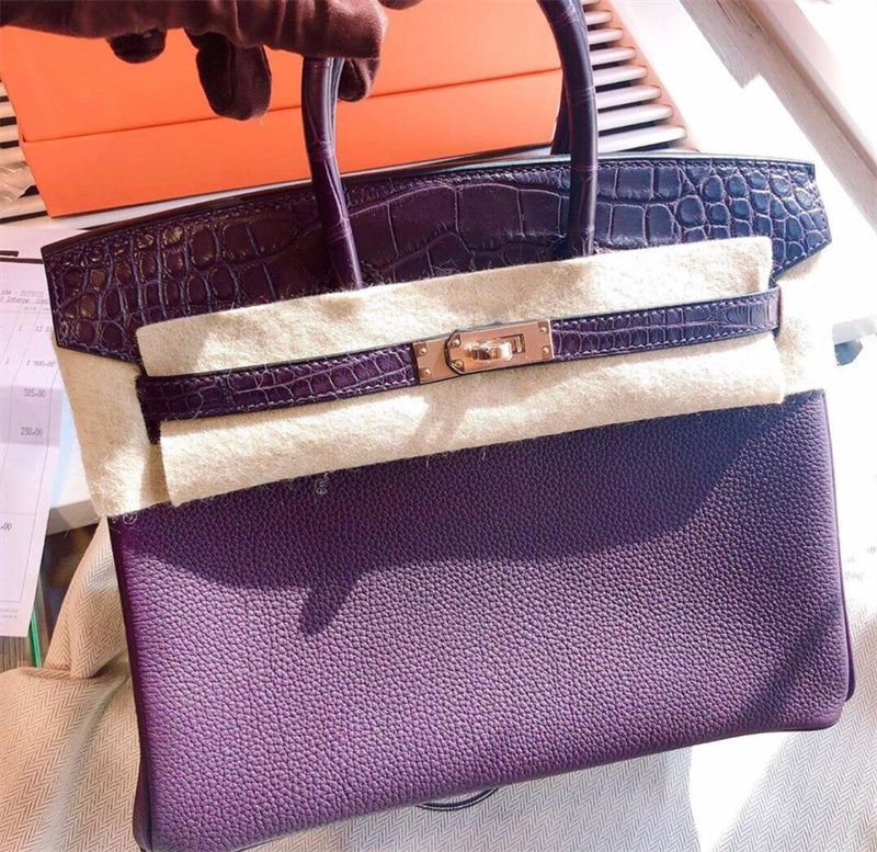  Sleek top-handle bag carried on shoulder 16
