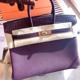  Sleek top-handle bag carried on shoulder 16
