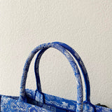 Side profile of classic statement women's handbag – women's premium purse