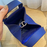 Side view of poised structured handbag