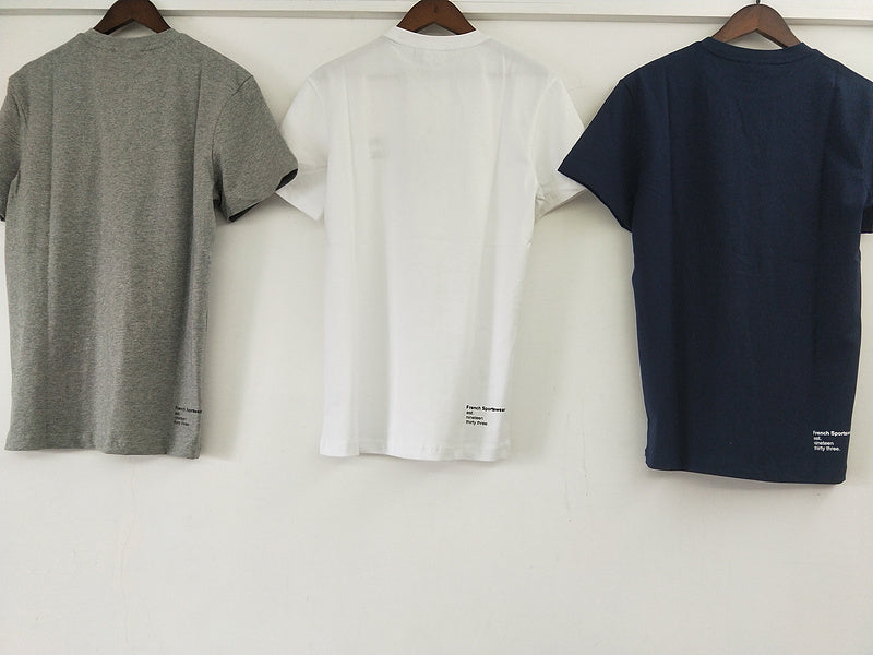 Flat lay presentation of Lacoste luxury clothing with signature branding