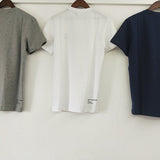 Flat lay presentation of Lacoste luxury clothing with signature branding