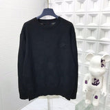 Front view of Louis Vuitton luxury clothing with signature branding