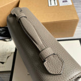 Handle and strap detail of chic elevated women's handbag – women's statement bag