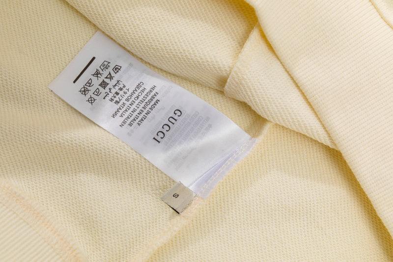 Close-up detail shot of Gucci luxury clothing with relaxed-fit cut