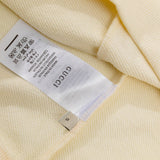 Close-up detail shot of Gucci luxury clothing with relaxed-fit cut