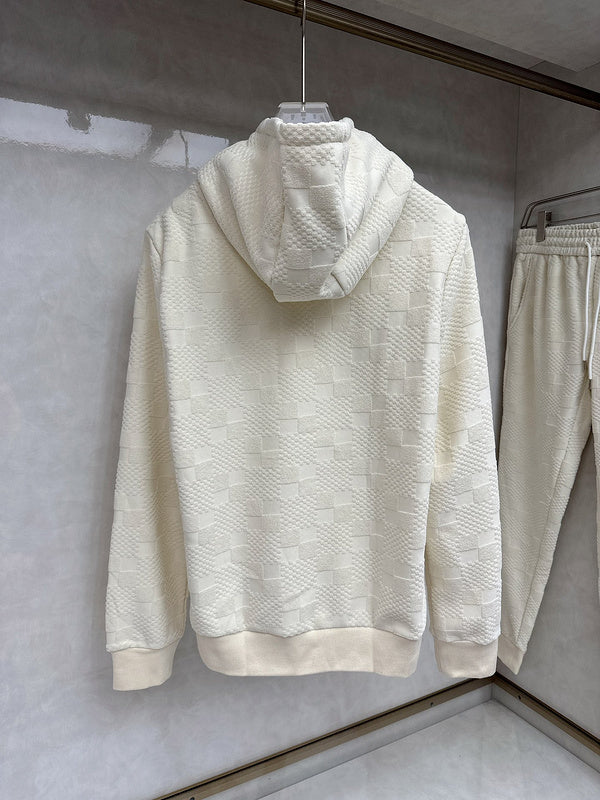 Flat lay presentation of Louis Vuitton luxury clothing with streetwear-inspired cut
