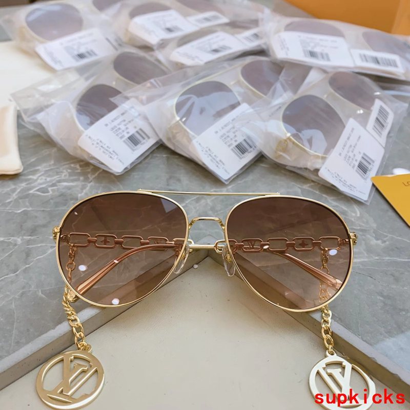 Close-up detail view of Louis Vuitton unisex sunglasses