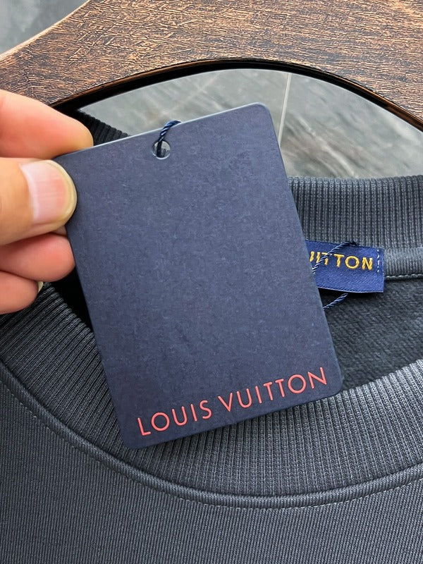 Close-up detail shot of Louis Vuitton luxury clothing with tailored silhouette