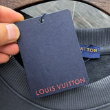 Close-up detail shot of Louis Vuitton luxury clothing with tailored silhouette