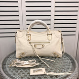 Front view of polished premium women's handbag – women's statement bag
