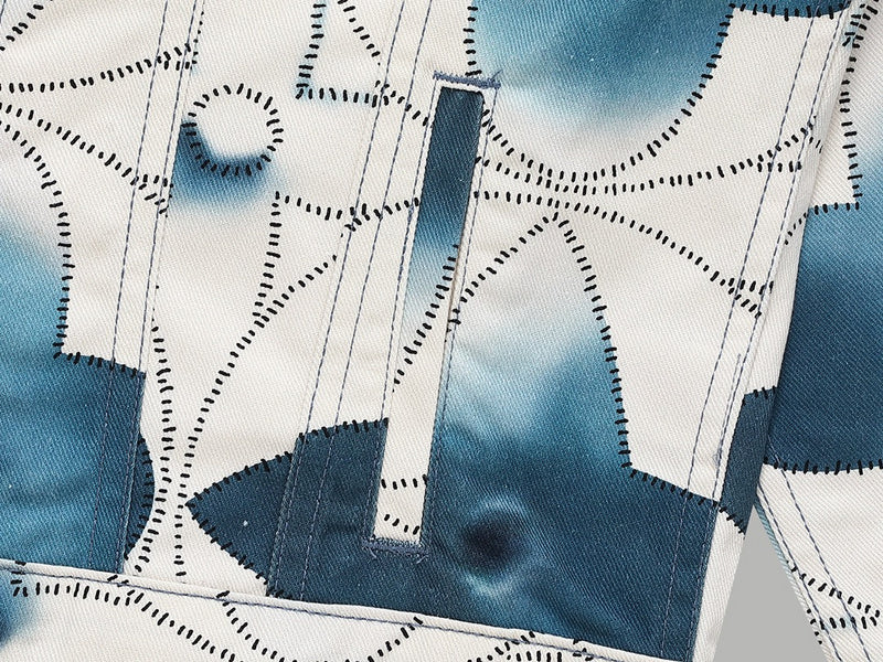 Close-up detail shot of Louis Vuitton luxury clothing with signature branding